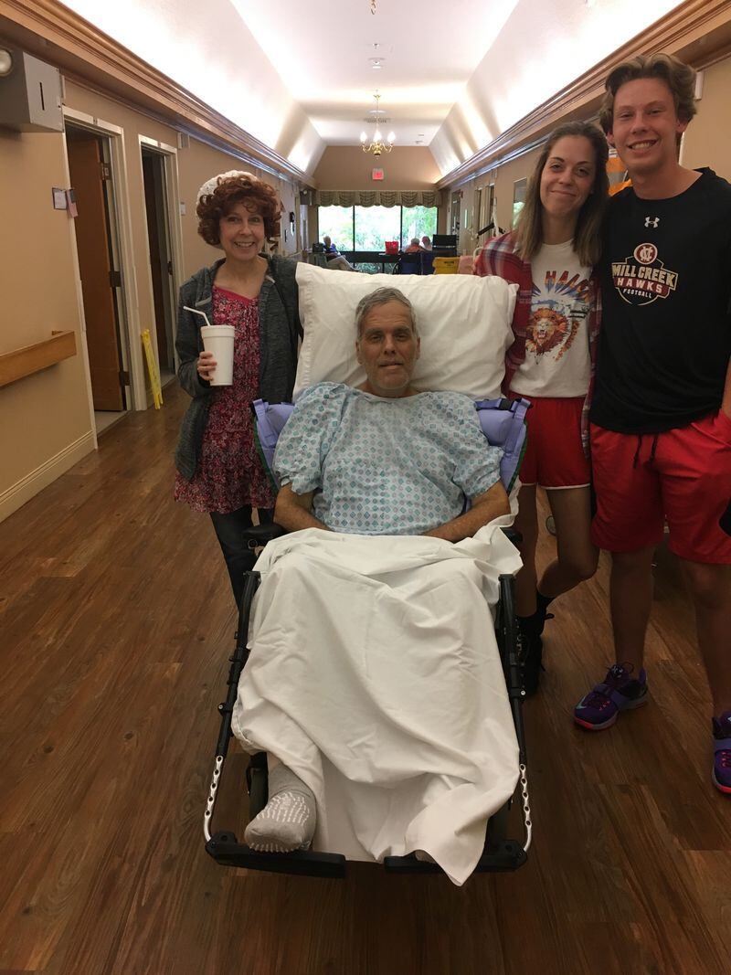 Mike Darby was barely able to move a finger when he was admitted to the New Horizons Limestone nursing and rehab facility in August. He took a photo with wife Deana, daughter Natalie and son Nicholas shortly after his admission.