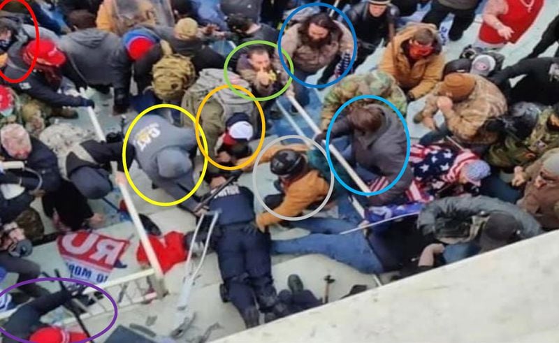 Locust Grove resident Jack Wade Whitton, circled in orange and second from left, is seen pulling a prone Capitol Police officer into a crowd of rioters on Jan. 6, 2021. "I fed him to the people,' Whitton wrote in a message to a friend.