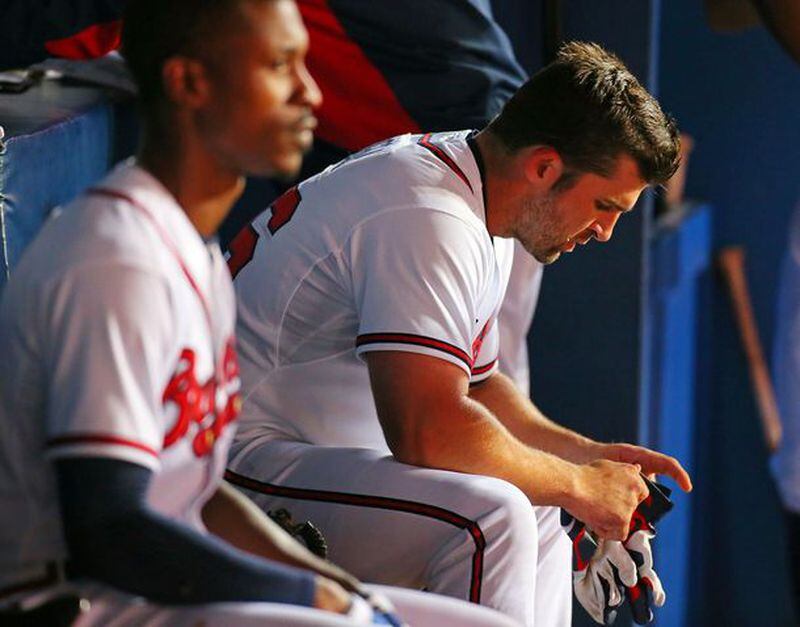 The Braves ate the remaining $20 million and 1 1/2 seasons left on the contract of Dan Uggla (right). They will try to trade disappointing B.J. Upton (left) this winter with three years left on his huge contract.