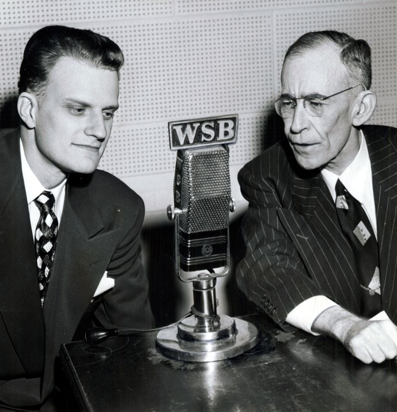 ATLANTA, GA - Feb. 8, 1950 - Journal Columnist Morgan Blake, right, talks with evangelist Billy Graham. The interview took place on The Journal's program 'Views of the News' on WSB. AJC FILE