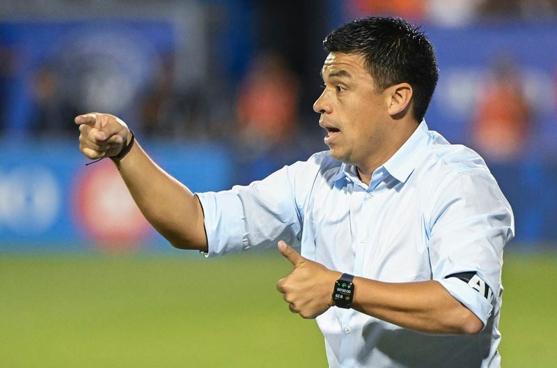 Atlanta United manager Gonzalo Pineda gives instruction from the sideline during second-half MLS soccer match action against CF Montreal in Montreal, Saturday, July 8, 2023. (Graham Hughes/The Canadian Press via AP)