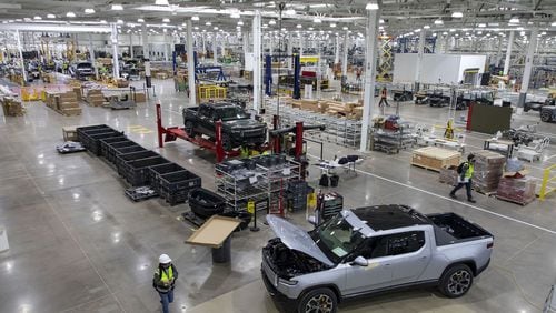 RT1 trucks are assembled and tested on April 14, 2021, before the new Rivian plant fully opens in Normal, Illinois. Rivian's proposed $5 billion plant in Georgia has made political waves. (Brian Cassella/Chicago Tribune/TNS)