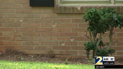 The exterior of the Cobb County house has several bullet holes. (Credit: Channel 2 Action News)