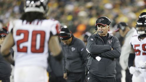 GREEN BAY, WI - DECEMBER 08: Head coach Mike Smith of the Atlanta Falcons looks on in the second quarter against the Green Bay Packers at Lambeau Field on December 8, 2014 in Green Bay, Wisconsin. (Photo by Mike McGinnis/Getty Images) Can Falcons coach Mike Smith save his job with just a division title? (Mike McGinnis, Getty Images)