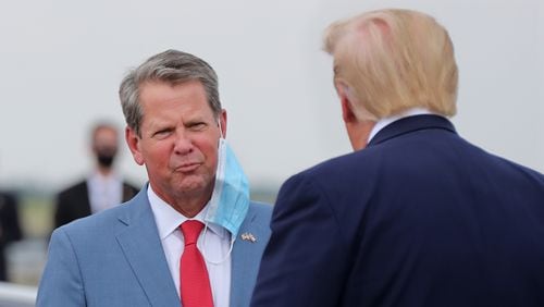 071520 Atlanta: Georgia Governor Brian Kemp greets President Donald Trump as he visits Georgia to talk about an infrastructure overhaul at the UPS Hapeville hub at Hartsfield-Jackson International Airport on Wednesday July 15, 2020 in Atlanta. The visit focuses on a rule change designed to make it easier to process environmental reviews.  Curtis Compton ccompton@ajc.com