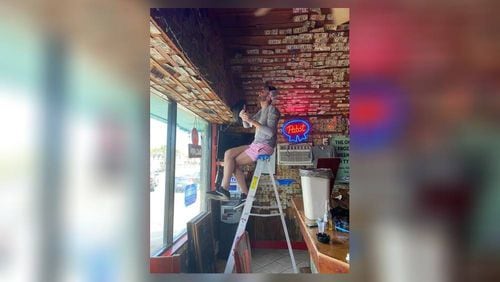 A Tybee Island bar owner recently removed nearly $4,000 from her walls and ceiling and gave it to her struggling employees.