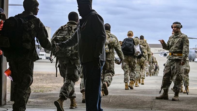 U.S Army troops prepare to board a C-17 transport aircraft headed for Eastern Europe, at Fort Bragg, N.C., Feb. 3, 2022. (Kenny Holston/The New York Times)