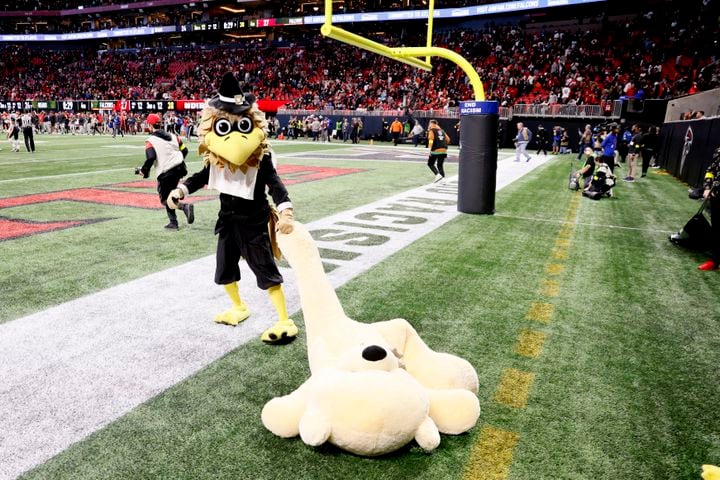 The Falcons mascot pulls a stuffed bear after Atlanta defeated the Bears on Sunday at Mercedes-Benz Stadium.
 (Miguel Martinez / miguel.martinezjimenez@ajc.com)