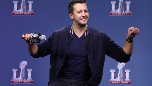 Luke Bryan got a surprise visit from some hilarious guests during his Super Bowl press conference. Photo: Curtis Compton, ccompton@ajc.com