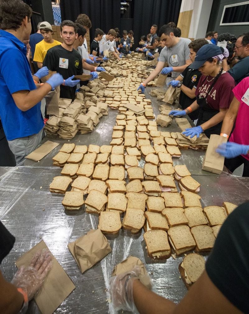 Volunteers make sandwiches at the coliseum in San Juan, where up to 90,000 meals a day were produced after Hurricane Maria. CONTRIBUTED BY WORLD CENTRAL KITCHEN