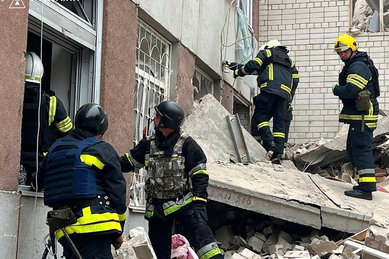 In this photo provided by the Ukrainian Emergency Service, rescuers work at the site of a Russian missile strike in Chernihiv, Ukraine, Wednesday, April 17, 2024. (Ukrainian Emergency Service via AP Photo)