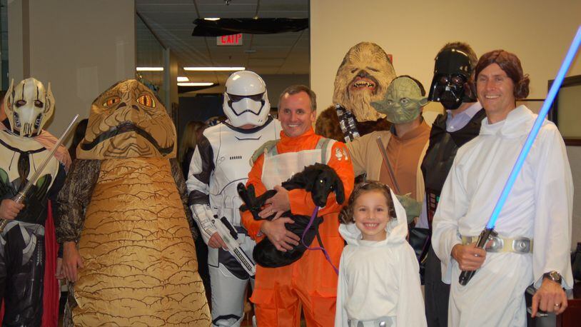 Tom Beaty (center, in orange jumpsuit) is the CEO of Norcross-based Insight Sourcing Group and also a “Star Wars” fan. On Friday, he will take the whole company to see the latest sequel, “The Last Jedi.” CONTRIBUTED BY INSIGHT SOURCING