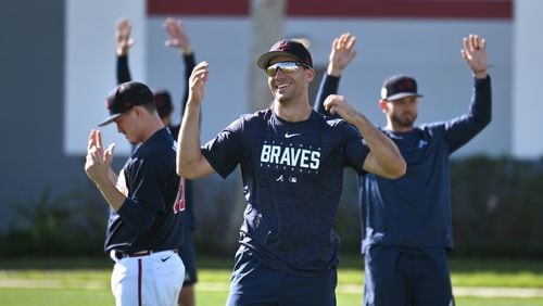 Atlanta Braves first baseman Matt Olson smiles as he warms up with  teammates during Braves spring training at CoolToday Park in North Port, Florida. (Hyosub Shin/The Atlanta Journal-Constitution/TNS)