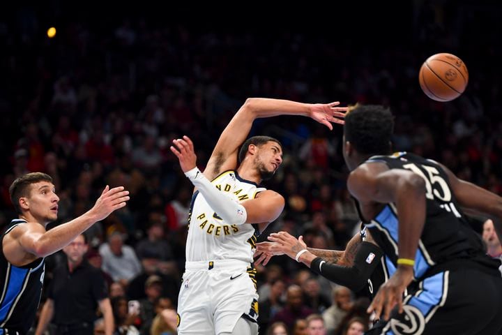 Indiana Pacers guard Tyrese Haliburton (0) passes against the Atlanta Hawks during the first half of an NBA game Tuesday, November 21, 2023. (Daniel Varnado/For the AJC)