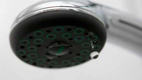 SCHWELM, GERMANY - JANUARY 10: Water drips from a shower head on January 10, 2007 in Schwelm, Germany. (Photo Illustration by Christof Koepsel/Getty Images)