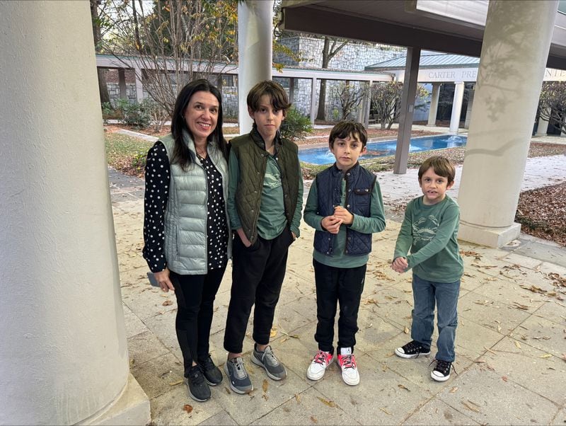 Renate Negri, of Brazil, and her three young sons