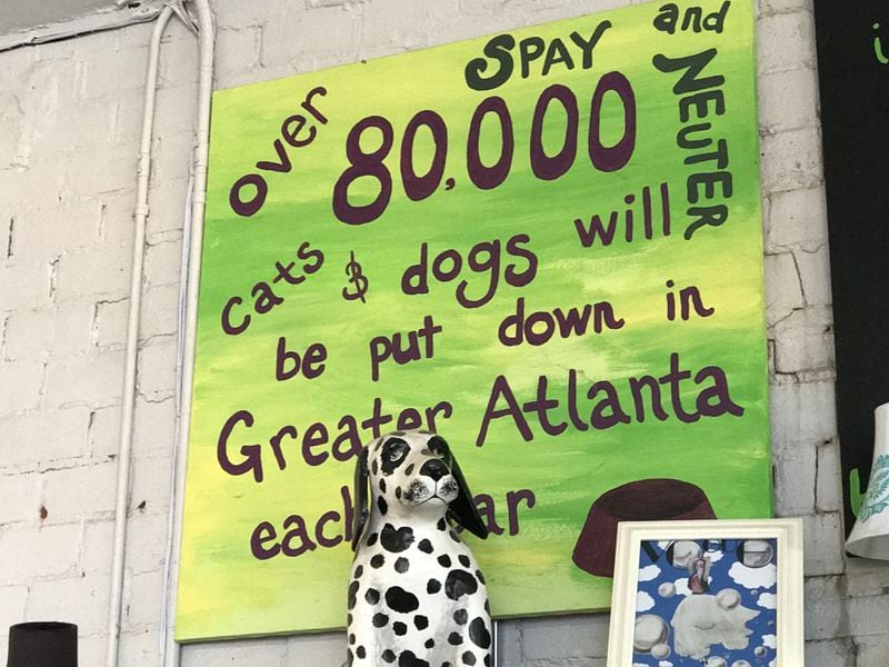 The Second Life Atlanta thrift store is decorated with pet art, some of it carries a message. CREDIT: SHELIA POOLE