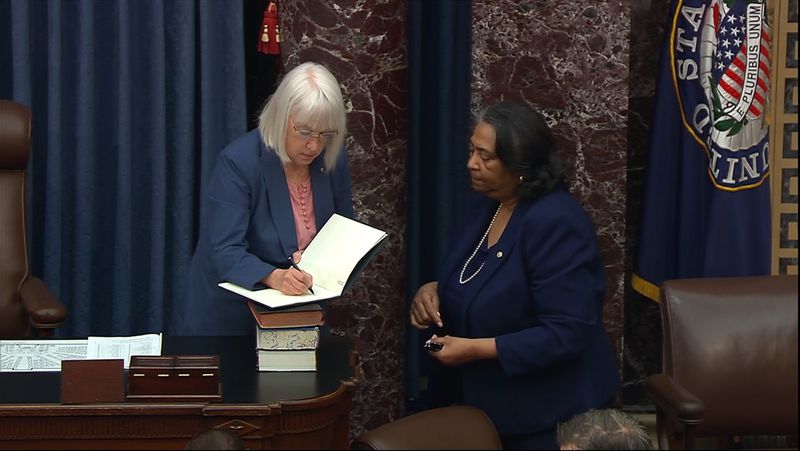 In this image from video from Senate Television, Sen. Patty Murray, D-Wash., signs the impeachment book for Secretary of the Senate Sonceria Berry during the impeachment trial of Homeland Security Secretary Alejandro Mayorkas on the Senate floor at the U.S. Capitol, Wednesday, April 17, 2024, in Washington. (Senate Television via AP)