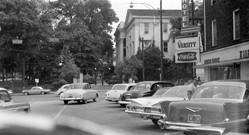 In this circa 1960 view, the Varsity’s downtown Athens restaurant is seen directly across from the famed University of Georgia arch. CONTRIBUTED BY GROWING UP IN ATHENS GA FACEBOOK PAGE