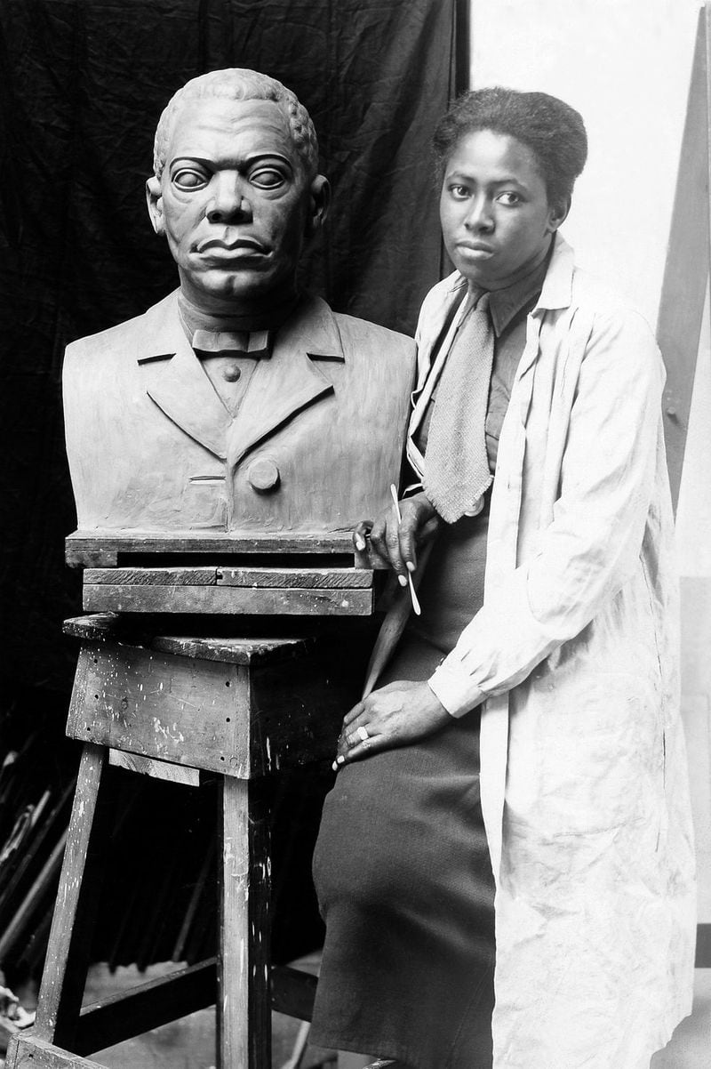 This photo of Selma Burke with her portrait bust of Booker T. Washington circa 1935 was taken by the Works Progress Administration as part of the Federal Art Project. The photographer is Pinchos Horn. CONTRIBUTED BY ARCHIVES OF AMERICAN ART, SMITHSONIAN INSTITUTION