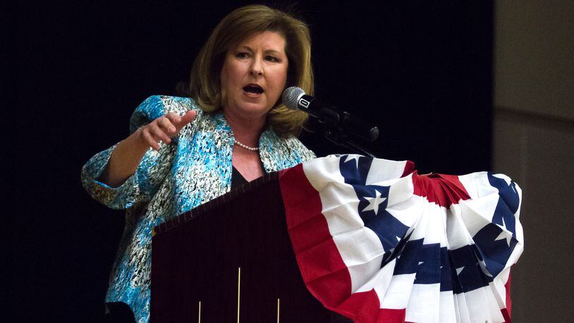 While on the campaign trail, U.S. Rep. Karen Handel, R-Roswell, has focused on GOP tax cuts and tried to link her opponent in November’s election, Lucy McBath, to Democratic bigwigs such as Nancy Pelosi and Hillary Clinton. STEVE SCHAEFER / SPECIAL TO THE AJC