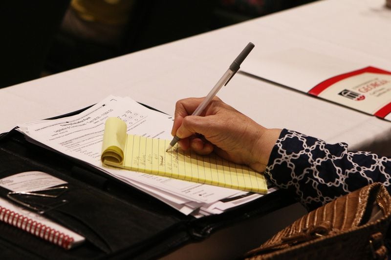 A Georgia tax officials takes notes during the Georgia Association of Tax Officials Conference on May 6, 2019, at the Classic Center in Athens. The rates tax commissioners use to charge cities for the fees they collect vary widely, the Georgia News Lab found. CHRISTINA R. MATACOTTA / CMATACOTTA@AJC.COM