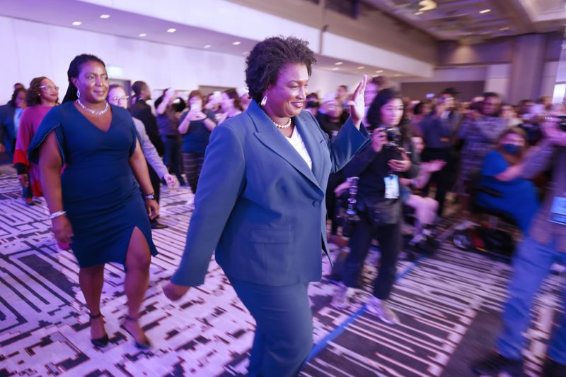 Stacey Abrams, the Democratic candidate for Governor of Georgia, waves to supporters as she walks toward the stage during the election night watch party at the Hyatt Regency in Atlanta on Tuesday, November 8, 2022. Miguel Martinez / miguel.martinezjimenez@ajc.com