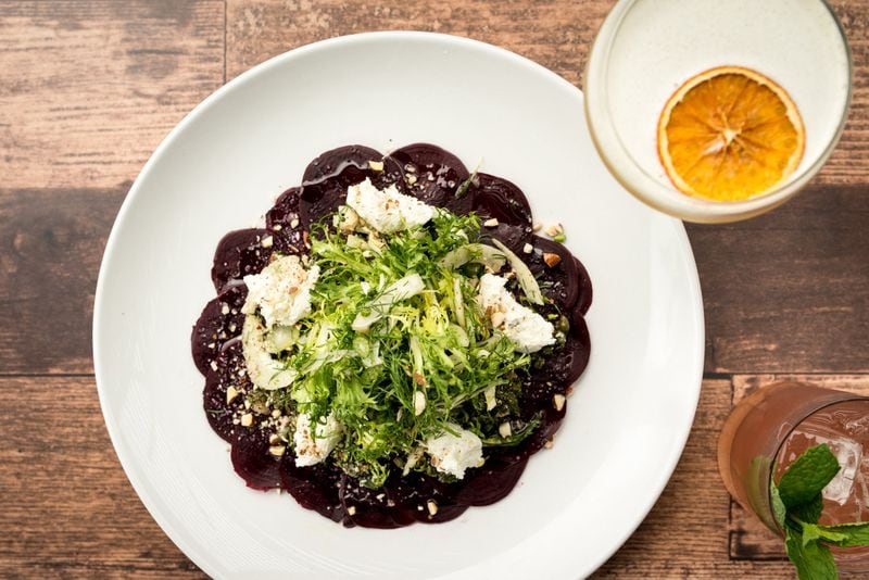 Roasted Beet Carpaccio with goat cheese, fennel, frisee, fennel-caper gremolata, almonds, and meyer lemon vinaigrette. Photo credit- Mia Yakel.