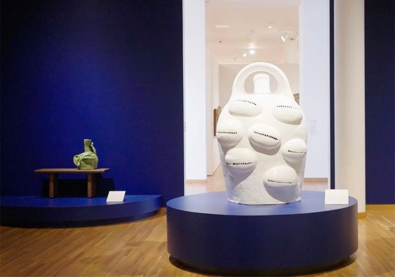 In "Large Jug" (2022), artist Simone Leigh looked to an Edgefield jug as a model but used the form as a canvas to display cowrie shells, objects associated with Black culture throughout the African diaspora. The white glaze evokes the kaolin used in Congolese and Edgefield ritualistic tradition.
