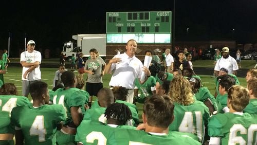 Coach John Ford addresses the Buford players after their win over Clarke Central.