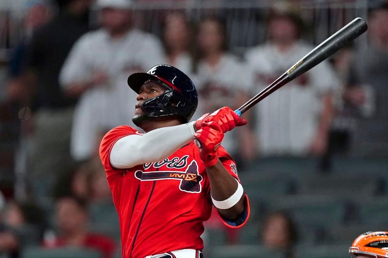 Atlanta Braves' Jorge Soler watches his three-run home run during the eighth inning of the team's baseball game against the San Francisco Giants on Friday, Aug. 27, 2021, in Atlanta. (AP Photo/John Bazemore)
