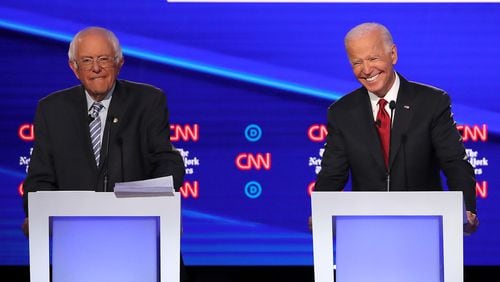 WESTERVILLE, OHIO - OCTOBER 15: Sen. Bernie Sanders (I-VT) and former Vice President Joe Biden react during the Democratic Presidential Debate at Otterbein University on October 15, 2019 in Westerville, Ohio. A record 12 presidential hopefuls are participating in the debate hosted by CNN and The New York Times. (Photo by Win McNamee/Getty Images)