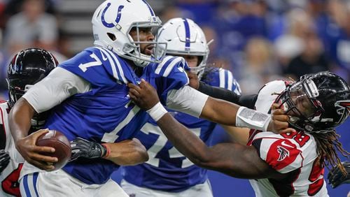 Falcons Takkarist McKinley (98) and Vic Beasley (44) close in on Colts quarterback Jacoby Brissett (7) for a sack during the second half Sept. 22, 2019, at Lucas Oil Stadium  in Indianapolis.