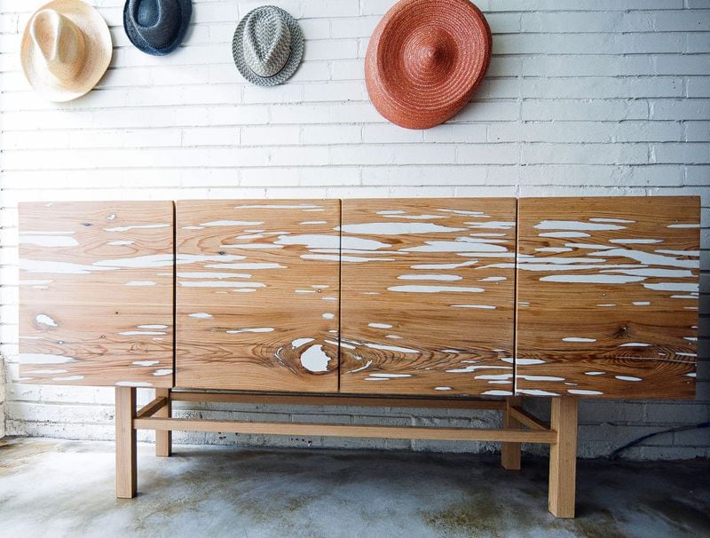 The media cabinet with it distinctive organic patterning, is made with pecky cypress by North Carolina based Sugarbone. Contributed by sugarbonegoods.com
