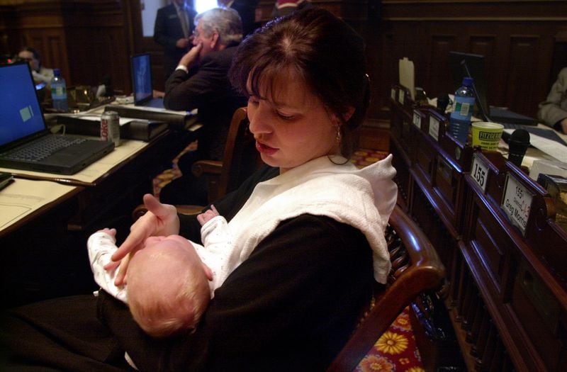 000217 ATLANTA: Rep. Sally Harrell (C,cq) and her two-month-old son Joseph (cq) attend the legislative session Thursday 2/17/00 as she manages being both mother and lawmaker. Harrell often brings Joseph to the House chamber as she conducts business. (DAVID TULIS/Staff)