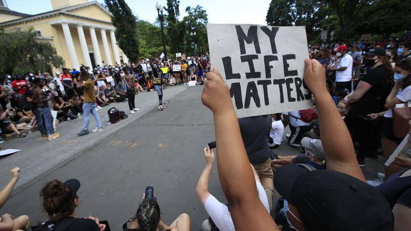 Demonstrators protest Friday, June 5, 2020, near the White House in Washington, over the death of George Floyd, a black man who was in police custody in Minneapolis. Floyd died after being restrained by Minneapolis police officers. (AP Photo/Manuel Balce Ceneta)