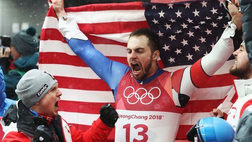 It's a big day when U.S. finishes third in sledding: Chris Mazdzer celebrates winning silver in the men's luge in South Korea. (Alexander Hassenstein/Getty Images)