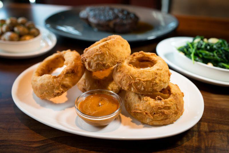  Fried Onion Rings are among the steakhouse sides at Kaiser's. Photo credit- Mia Yakle.