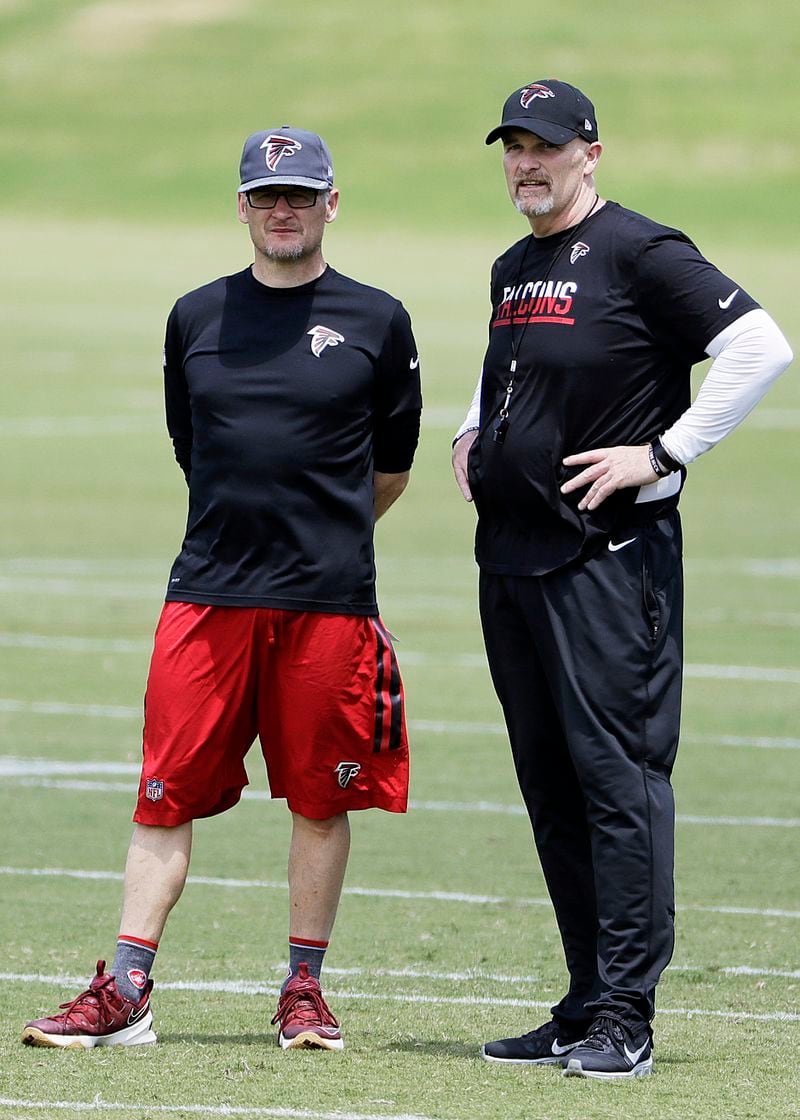 Falcons general manager Thomas Dimitroff (left) and coach Dan Quinn were among those in attendance at Georgia’s Pro Day.