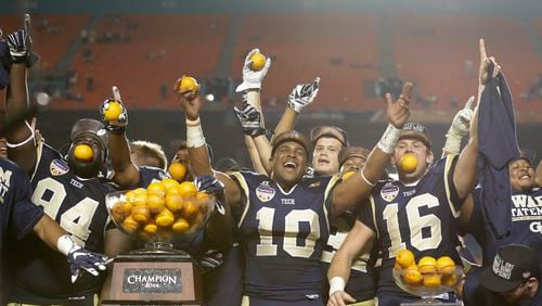 Georgia Tech players celebrate with their trophy after Georgia Tech defeated Mississippi State 49-34 in the Orange Bowl NCAA college football game, Wednesday, Dec. 31, 2014 in Miami Gardens, Fla. (AP Photo/Wilfredo Lee) Georgia Tech football players and other scholarship athletes will begin receiving stipends worth about $1,600 starting next school year. (ASSOCIATED PRESS)