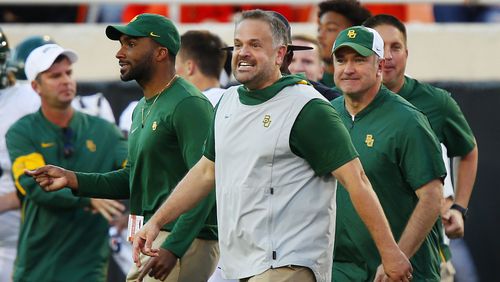 Head coach Matt Rhule of the Baylor University Bears grins as he heads onto the field after beating the Oklahoma State Cowboys on October 19, 2019 at Boone Pickens Stadium in Stillwater, Oklahoma.  Baylor stayed undefeated with a 45-27 road win.  (Photo by Brian Bahr/Getty Images)