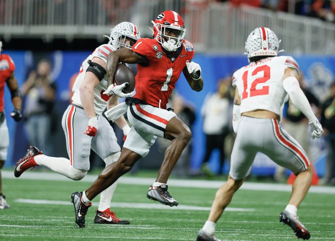 Georgia Bulldogs wide receiver Marcus Rosemy-Jacksaint (1) gains first down yardage on a 28 yard third down play during the second quarter of the College Football Playoff Semifinal between the Georgia Bulldogs and the Ohio State Buckeyes at the Chick-fil-A Peach Bowl In Atlanta on Saturday, Dec. 31, 2022. (Jason Getz / Jason.Getz@ajc.com)