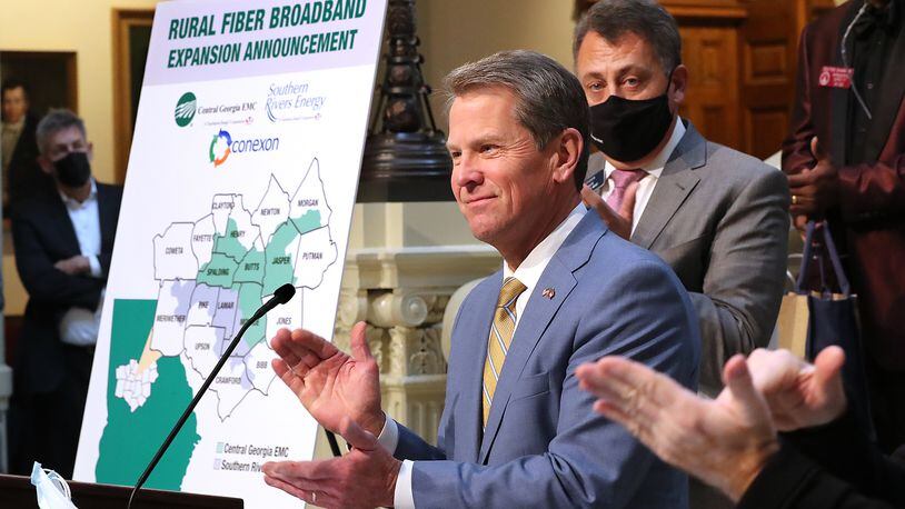 Gov. Brian Kemp applauds while speaking Monday during a press conference about expanding rural internet access in Georgia at the Capitol in Atlanta. Curtis Compton / Curtis.Compton@ajc.com”