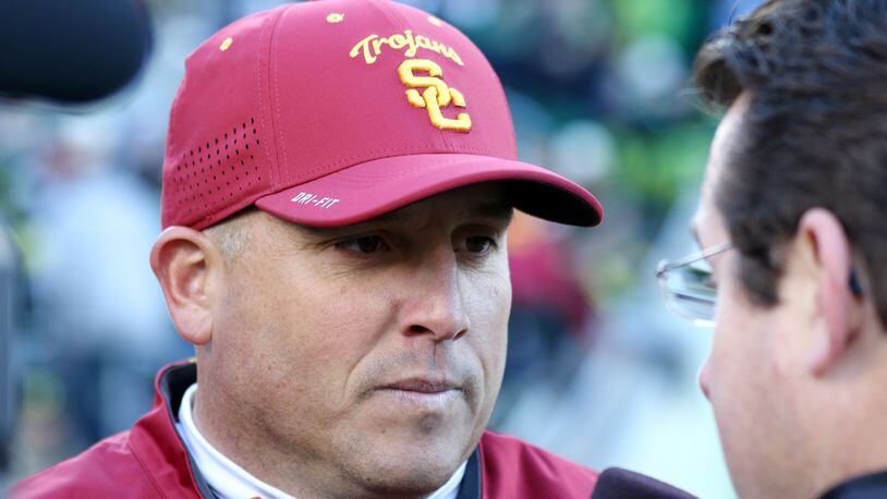 Southern California head coach Clay Helton is seen during the second half of an NCAA college football game against Southern California, Saturday, Nov. 21, 2015, in Eugene, Ore. (AP Photo/Ryan Kang)