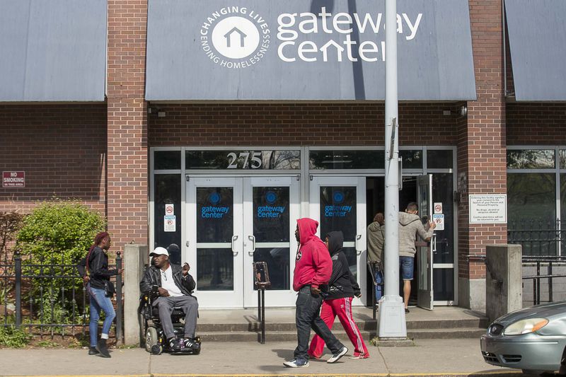 04/01/2020 - Atlanta, Georgia  - People gather outside of the Gateway Center in Atlanta, Wednesday, April 1, 2020. The Gateway Center is a homeless service center. (ALYSSA POINTER / ALYSSA.POINTER@AJC.COM)