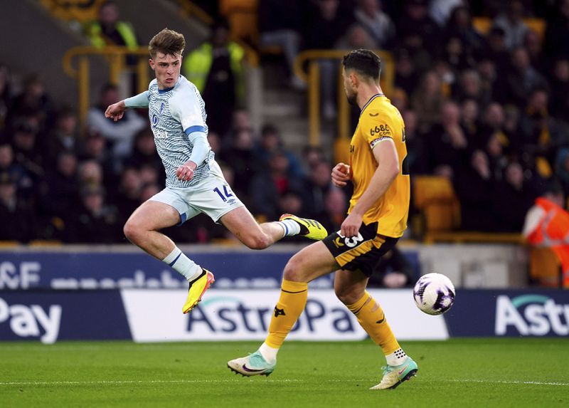 Bournemouth's Alex Scott, left, and Wolverhampton Wanderers' Max Kilman vie for the ball during the English Premier League soccer match between Wolverhampton Wanderers and Bournemouth, Wednesday, April 24, 2024, at Molineux in Wolverhampton, England,. (David Davies/PA via AP)