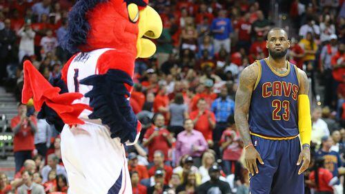 Mascot Harry the Hawk and Cavaliers LeBron James stare down just before tip off in Game 2 of the Eastern Conference Finals last season in Atlanta. Curtis Compton / ccompton@ajc.com