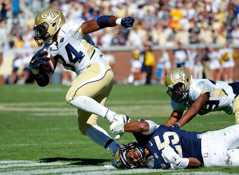 ATLANTA, GA - OCTOBER 17: Marcus Marshall #34 of the Georgia Tech Yellow Jackets is tackled by Pat Amara #25 of the Pittsburgh Panthers at Bobby Dodd Stadium on October 17, 2015 in Atlanta, Georgia. (Photo by Kevin C. Cox/Getty Images)