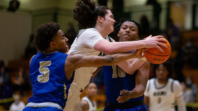 Grayson's Ian Schieffelin is swarmed by the McEachern defense.  February 27, 2021, at Grayson High School in Loganville, Georgia. McEachern defeated Grayson 57-56 in overtime. CHRISTINA MATACOTTA FOR THE ATLANTA JOURNAL-CONSTITUTION