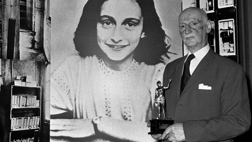 FILE - In this Monday, June 14, 1971 photo Dr. Otto Frank holds the Golden Pan award, given for the sale of one million copies of the famous paperback 'The Diary of Anne Frank' in London, Great Britain. New research suggests that the family of Anne Frank, the world-famous Jewish diarist who died in the Holocaust, attempted to immigrate to the United States and later also to Cuba, but their efforts were tragically thwarted by America's immigration policy, cumbersome bureaucracy and the outbreak of World War II. Only Otto Frank survived the holocaust. (AP Photo/Dave Caulkin, file)